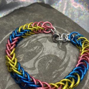 Bracelet woven in the persian 4 in 1 weave using the colors of the Pansexual Pride Flag, pink, yellow, and blue.